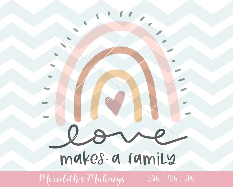 May include: A rainbow with three arches in pink, brown, and yellow with a small pink heart in the center. The text "love makes a family" is written below the rainbow.