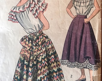 May include: Vintage sewing pattern for a skirt and blouse. The skirt is a full circle skirt with a zig-zag pattern and a ruffle at the hem. The blouse has a ruffled neckline and sleeves. The pattern is printed on a light brown paper with a vintage look.