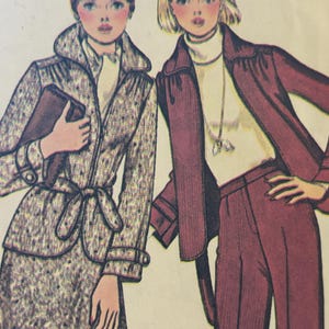May include: A vintage fashion illustration featuring two figures. The left figure wears a grey speckled belted coat with a collar and holds a dark clutch. The right figure wears a solid dark red jacket over a white turtleneck and matching trousers.