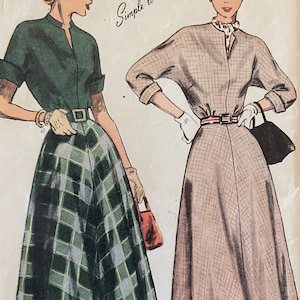 May include: Vintage illustration of two women's outfits. One woman wears a green top and a plaid skirt. The other wears a plaid dress with a red beret and gloves. The text "Simple to Make" is written above the women.