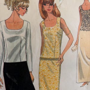 May include: Vintage sewing pattern featuring three women's dress designs. The first dress is a white top with long sleeves and a black skirt. The second dress is a sleeveless yellow dress with a floral pattern and a belt. The third dress is a sleeveless white dress with a lace top and a long skirt.