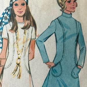 May include: Illustration of two women in vintage dresses. One wears a white dress with a gold necklace and a blue and white patterned headscarf. The other wears a light blue dress with a high collar and pockets.
