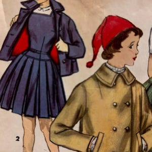 May include: Vintage sewing pattern featuring illustrations of children's clothing. The designs include a navy blue dress with a pleated skirt, a matching jacket, and a tan double-breasted coat. The pattern is from the mid-20th century.