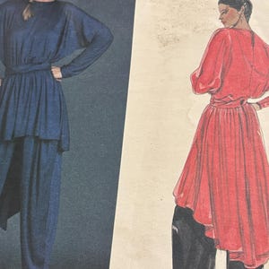 May include: A vintage sewing pattern featuring two women's outfits. The first outfit is a blue jumpsuit with a draped top and a sash. The second outfit is a red dress with a draped skirt and a sash. The pattern is labeled "International Size"