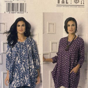 May include: A Vogue Patterns sewing pattern envelope V9171 by Marcy Tilton for a loose-fitting tunic. The cover displays two variations: one in a blue and white abstract print and another in a purple and white polka dot print with side pockets.