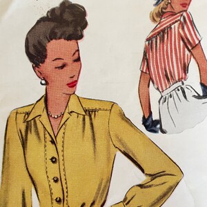 May include: A vintage sewing pattern illustration featuring two women wearing blouses. The woman on the left is wearing a yellow blouse with long sleeves and a button-up front. The woman on the right is wearing a red and white striped blouse with short sleeves.
