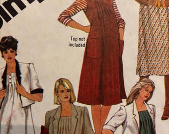May include: A sewing pattern featuring four different dress styles. The dresses are a red sleeveless dress with a pocket, a white dress with a black jacket, a beige dress with a brown jacket, and a green dress with a white jacket. The text "Top not included" is printed on the image.