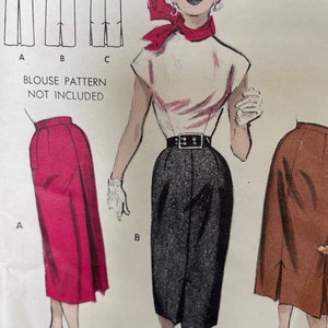 May include: A vintage sewing pattern for a skirt with three different styles. The pattern includes a red skirt, a black skirt, and a brown skirt. The pattern also includes a drawing of a woman wearing a white blouse and a black skirt.