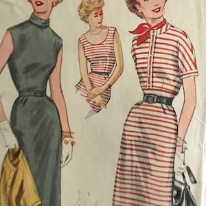 May include: A vintage sewing pattern illustration showing three women wearing different styles of dresses. The first dress is a sleeveless, grey, fitted dress with a high neckline. The second dress is a sleeveless, red and white striped dress with a scoop neckline. The third dress is a red and white striped dress with a short-sleeved, button-up top and a collar. All three dresses are fitted and have a cinched waist.