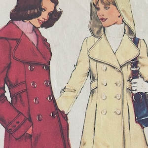 May include: Illustration of two women wearing vintage coats. One coat is a deep red with a double-breasted design, while the other is a cream-colored coat with a hood. Both coats have a classic, tailored look, suggesting a retro fashion theme.