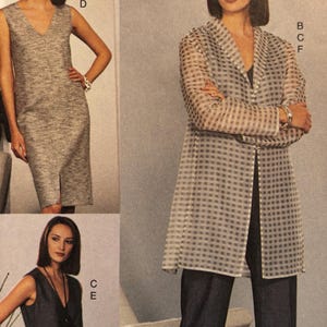 May include: A set of three ceramic mugs with a speckled, matte finish. The mugs are in shades of cream, light gray, and dark gray. Each mug has a simple, minimalist design, perfect for coffee or tea.