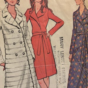May include: Vintage sewing pattern for three different dresses. The pattern is for a long white fur coat, a red wrap dress with a belt, and a blue floral wrap dress. The pattern is from Mary Lester Fabrics, Wyoming Valley Mill, Wilkes-Barre, Pennsylvania.