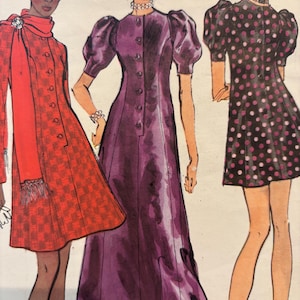 May include: A vintage sewing pattern featuring three women's dress designs. The first dress is a red and white checkered dress with a long scarf. The second dress is a purple dress with a button-up front and puffed sleeves. The third dress is a black and white polka dot dress with short sleeves.