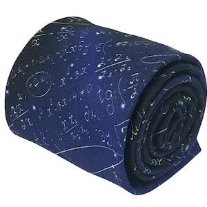May include: A dark blue necktie with a white pattern of mathematical equations and symbols. The tie is rolled up and ready to be worn.