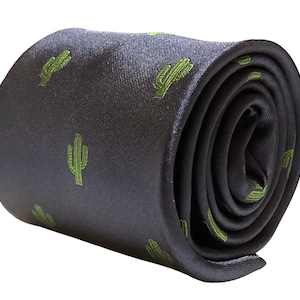 May include: A dark blue necktie with a repeating pattern of green cactus plants.
