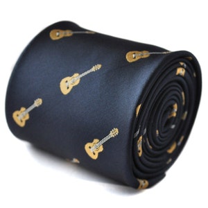 May include: A dark blue necktie with a repeating pattern of gold acoustic guitars.