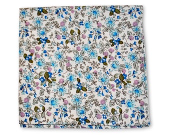 May include: A white cotton pocket square with a blue and pink floral pattern.