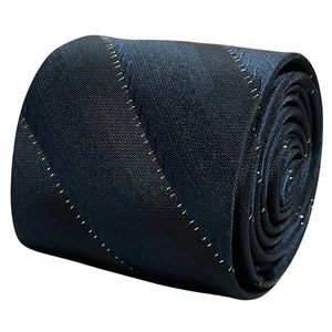 May include: A dark blue patterned tie with a subtle sheen. The tie has a diagonal pattern with white stitching.