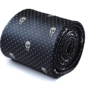 May include: A black silk tie with a white polka dot pattern and white skull designs.