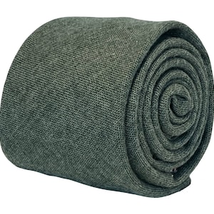 May include: A dark green rolled necktie made of a textured fabric.