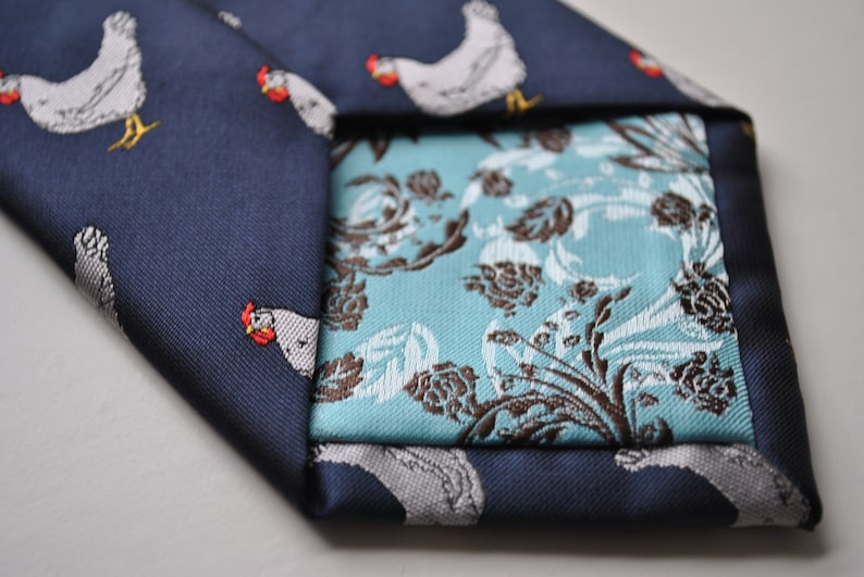 navy tie with chicken embroidered design with signature floral design to the rear by Frederick Thomas FT1531 image 4