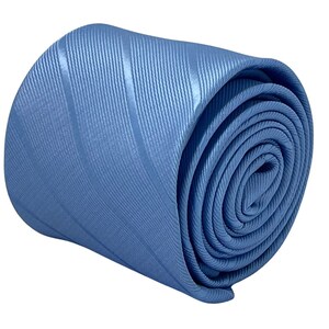 May include: A rolled up blue striped tie. The tie is made of a silky material and has a subtle sheen.