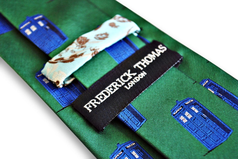 green tie with blue policeman tardis box embroidered design with signature floral design to the rear by Frederick Thomas FT3227 image 3