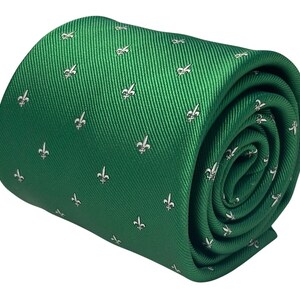 May include: A green silk tie with a white fleur-de-lis pattern.