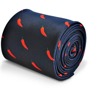 May include: A dark blue necktie with a repeating pattern of red chili peppers.