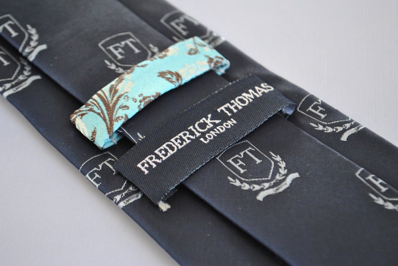 Navy tie with Frederick Thomas crest design by Frederick | Etsy