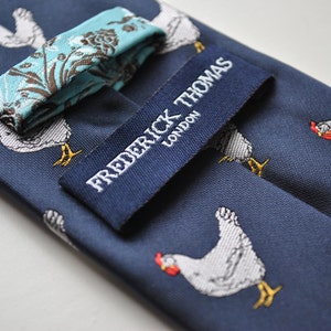 navy tie with chicken embroidered design with signature floral design to the rear by Frederick Thomas FT1531 image 3