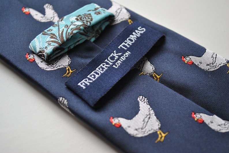 navy tie with chicken embroidered design with signature floral design to the rear by Frederick Thomas FT1531 image 3