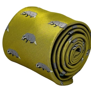 May include: A yellow silk tie with a repeating pattern of gray and white badgers.