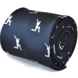May include: A dark blue necktie with a white repeating pattern of cricket players in a bowling position.