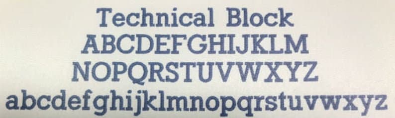 May include: A close-up of a white surface with the text "Technical Block" in dark blue, followed by the uppercase and lowercase alphabet in a serif font. The letters are evenly spaced and clearly printed.