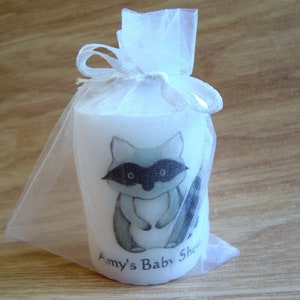 Close up of raccoon candle in organza bag