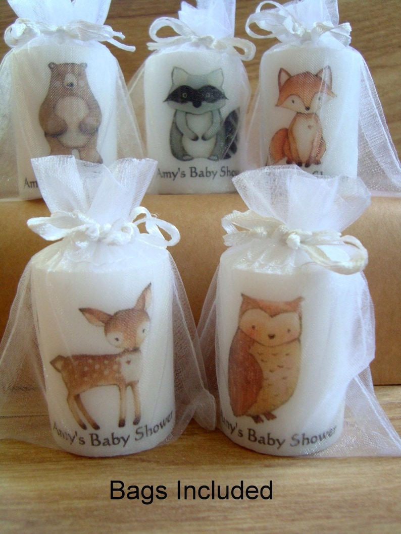 Close up of woodland animals in white organza bags.  Bags are included in purchase.