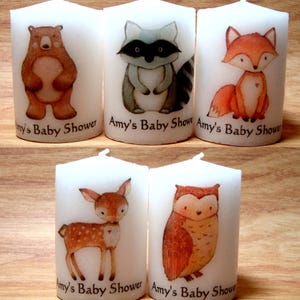 Close up of bear, raccoon, fox, deer and owl woodland critters candles.
