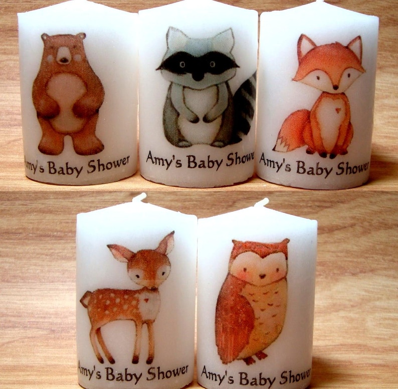 Close up of bear, raccoon, fox, deer and owl woodland critters candles.