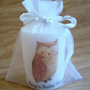 Close up of owl animal candle in organza bag
