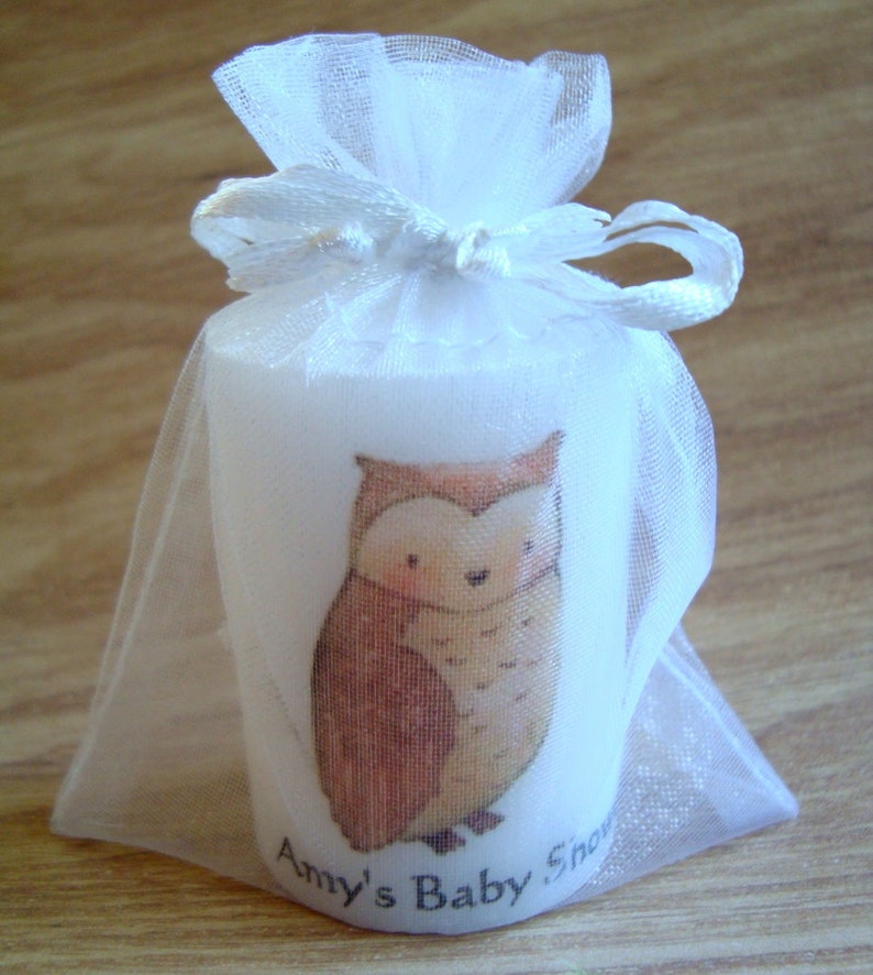 Close up of owl animal candle in organza bag