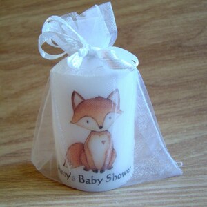 Close up of fox animal candle in organza bag
