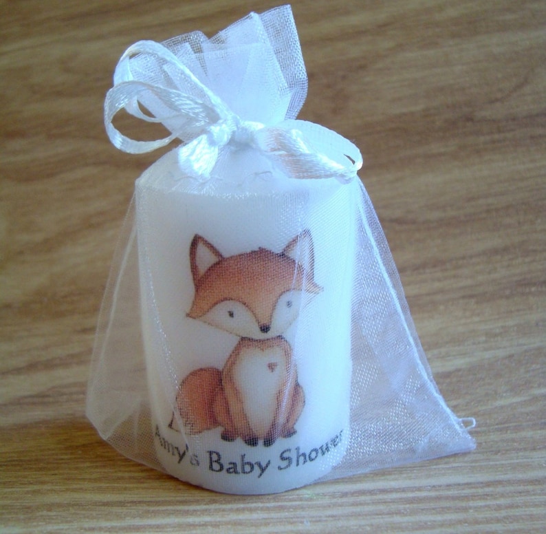 Close up of fox animal candle in organza bag