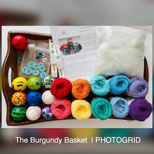 May include: A craft kit for making an octopus with colorful yarn, a pattern, and a wooden tray filled with small balls and other supplies. The kit includes the text "Octopus Set: A Burgundy Basket Pattern".