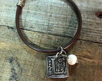 Leather bracelet with fine silver wax seal initial charm and freshwater pearl.