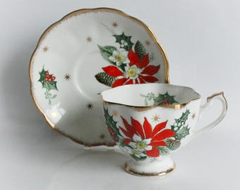 Christmas Teacup and Saucer Noel Poinsettia Holly Queen Anne Bone China