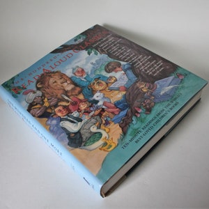 May include: A hardcover book titled "One Hundred Read Aloud Classics" with a colorful illustration of various storybook characters. The book has a light blue spine and includes text about ten-minute readings from children's books.