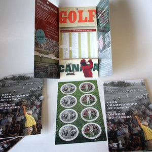 May include: A collection of golf-themed memorabilia, including brochures and stickers. The brochures feature the text "OPEN CHAMPIONSHIP OF CANADA" and "OMNIUM DU CANADA." The stickers have a golfer image. The word "GOLF" is displayed in large orange letters.