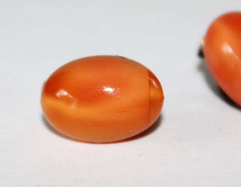 Vintage Orange Glass Earrings Clip Ons 1930s Glow Oval Cats Eye Pattern