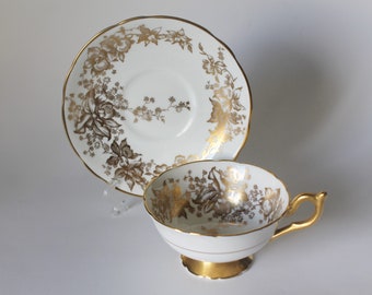 Coalport theekop en schotel gouden bloemen en wit patroon 10187